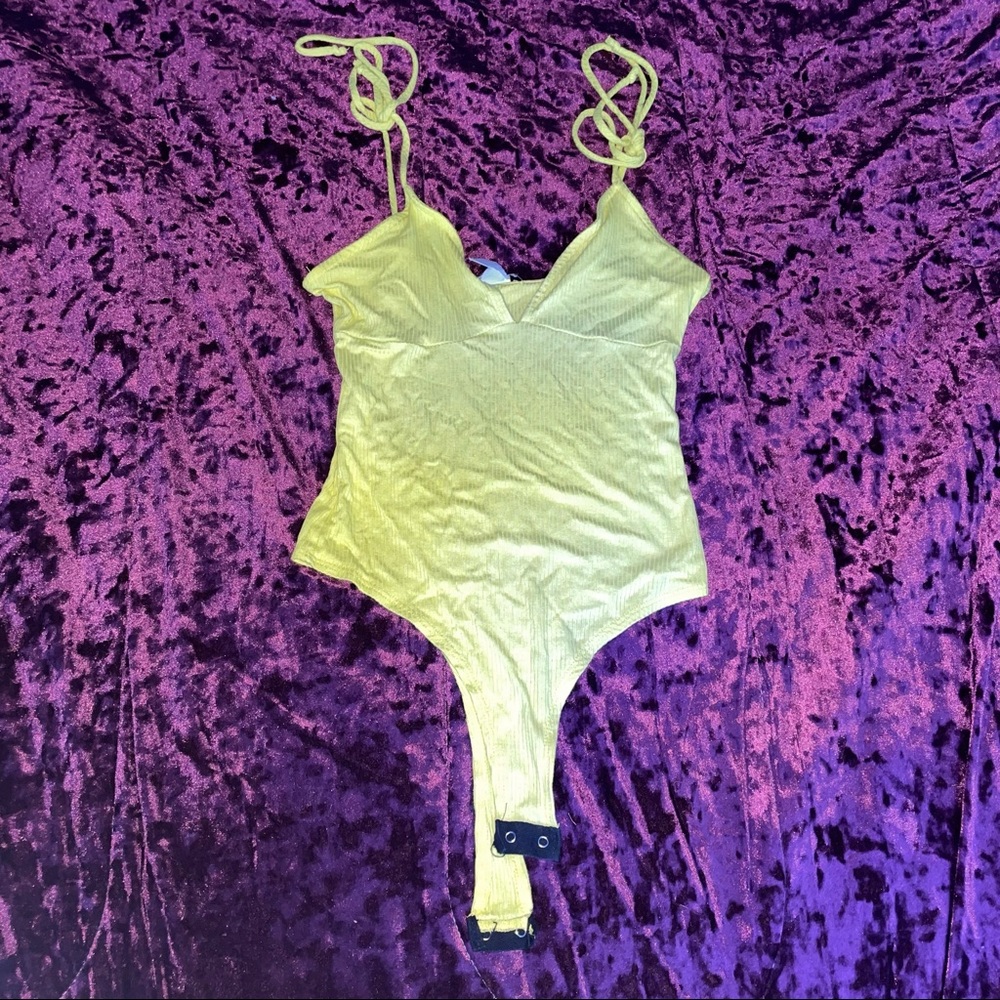 Yellow bodysuit